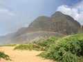 Fall Day with Rainbows at Polihale Beach on Kauai Island in Hawaii.