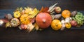 Fall decor for Thanksgiving Day with pumpkins, leaves, apples, lights on wooden table Royalty Free Stock Photo