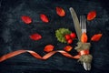 Fall dinner fork and knife in canvas cloth, ribbon and autumn le Royalty Free Stock Photo