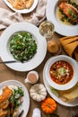 Fall dinner table with soup, salad and main dishes