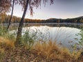 Fall evening on the lake. Beautiful forest lake Royalty Free Stock Photo