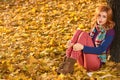 Fall Fashion. Woman in Autumn park,Outdoor.Sadness Royalty Free Stock Photo