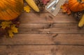 Fall flat lay composition for Thanksgiving. Autumn pumpkins and cutlery on jute material. Copy space on wood. Royalty Free Stock Photo