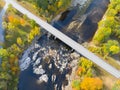 Fall Foliage Along a River Bridge