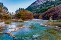 Fall foliage on the crystal clear Frio River in Texas. Royalty Free Stock Photo