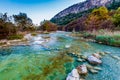 Fall foliage on the crystal clear Frio River in Texas. Royalty Free Stock Photo