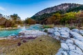 Fall foliage on the crystal clear Frio River in Texas. Royalty Free Stock Photo