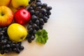 Fall fruits still life. Grapes and apples on a light background. Royalty Free Stock Photo