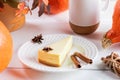 Fall, Halloween, thanksgiving composition with pumpkin cake piece on white plate and orange pumpkins Royalty Free Stock Photo