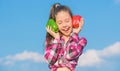 Fall harvest homegrown vegetables. Choose which. Alternative decision concept. Kid girl hold red and green peppers sky