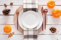 Fall harvest or thanksgiving dinner table setting, above view on white wood Royalty Free Stock Photo