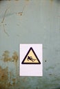 Fall hazard sign on industrial background