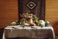 Fall holiday table decoration setting on wooden table. Rustic style