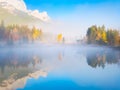 Banff National Park, Alberta, Canada. Fall. Landscape during sunrise. Autumn trees on the river bank. Mountains and forest.