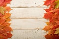 Fall leaves frame on whooden background