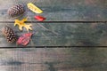Fall leaves and pine cones decorating a wood deck - great autumn background. Royalty Free Stock Photo