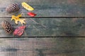 Fall leaves and pine cones decorating a wood deck - great autumn background.