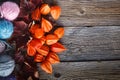 Fall leaves and wool clew on rustic wooden background