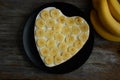 Heart shaped chocolate cake with banana slice Royalty Free Stock Photo