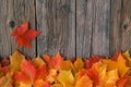 Fall maple leaf on wooden table, background texture Royalty Free Stock Photo