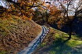 Fall pathway with wooden fence