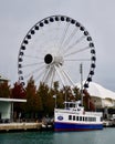 A Small Cruse Ship Docked Along Navy Pier