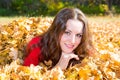 Fall. Portrait of beautiful young woman in autumn park