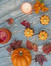 Fall pumpkin spice cupcakes with creamy frosting and autumn toppings candles and autumn leaves . Royalty Free Stock Photo