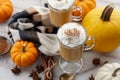 Fall pumpkin spice latte with whipped cream on white wooden background Royalty Free Stock Photo