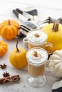 Fall pumpkin spice latte with whipped cream on white wooden background Royalty Free Stock Photo