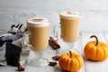 Fall pumpkin spice latte with whipped cream on white wooden background Royalty Free Stock Photo