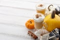 Fall pumpkin spice latte with whipped cream on white wooden background Royalty Free Stock Photo