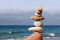 The fall of the pyramid of balanced stones. The concept of fall risk and unstable equilibrium Royalty Free Stock Photo