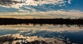 Fall reflections in the lake with beautiful skyline and cloud