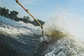 Fall for riding a wakeboard on the background of a big wave