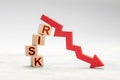 Fall risk. Red down arrow as a symbol of crisis or risky investment Royalty Free Stock Photo