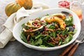 Fall salad with greens and acorn squash