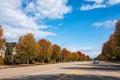 Fall scenery of long rows of golden red trees along an avenue in autumn foliage Vancouver Canada Royalty Free Stock Photo