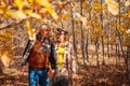 Fall season activities. Senior couple walking in autumn park. Retired man and woman holding hands outdoors Royalty Free Stock Photo