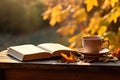 Cup of hot tea and book in the park, autumn leaves , AI Generated Royalty Free Stock Photo