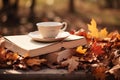 Cup of hot tea and book in the park, autumn leaves , AI Generated Royalty Free Stock Photo