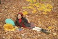 fall season fashion. teen girl in school uniform hold autumn leaves. happy child Royalty Free Stock Photo