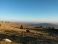 Fall season at the mountain with colorfully trees, meadows and hills