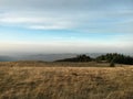 Fall season at the mountain with colorfully trees, meadows and hills