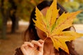 Fall, Season, People Concept - Woman With Yellow Autumn Leaf