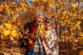 Fall season. Senior couple walking in autumn park. Middle-aged man and woman hugging and relaxing outdoors Royalty Free Stock Photo