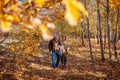 Fall season walk. Senior family couple walking in autumn park. Man and woman relaxing outdoors Royalty Free Stock Photo