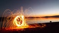 Fall Silhouette by the lake with Fire Light Painting Royalty Free Stock Photo