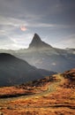 Fall slopes of the resort of Zarmatt are a local landmark and a bright beautiful landscape with the famous Matterhorn peak in Royalty Free Stock Photo