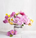 Fall still life with colorful Chrysanthemums bunch on old white wooden table